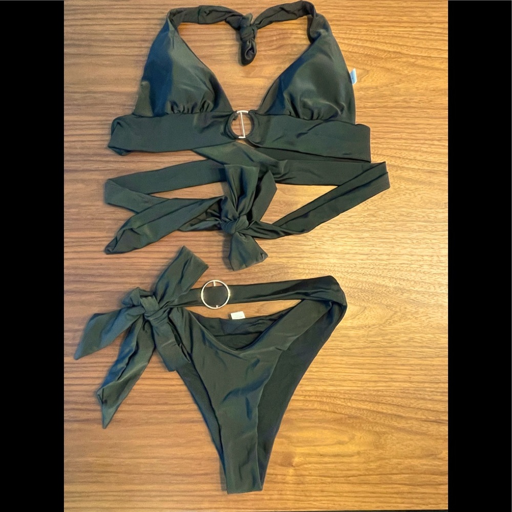 *SOLD* Halter style black bikini. Metal detail gives the bikini a chic look.
